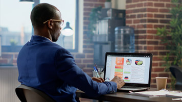 man looking at laptop