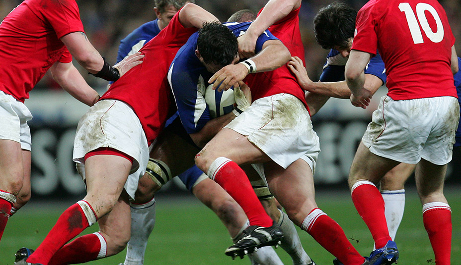 Rugby players tackling