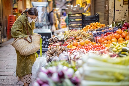 woman shopping in local fruit market